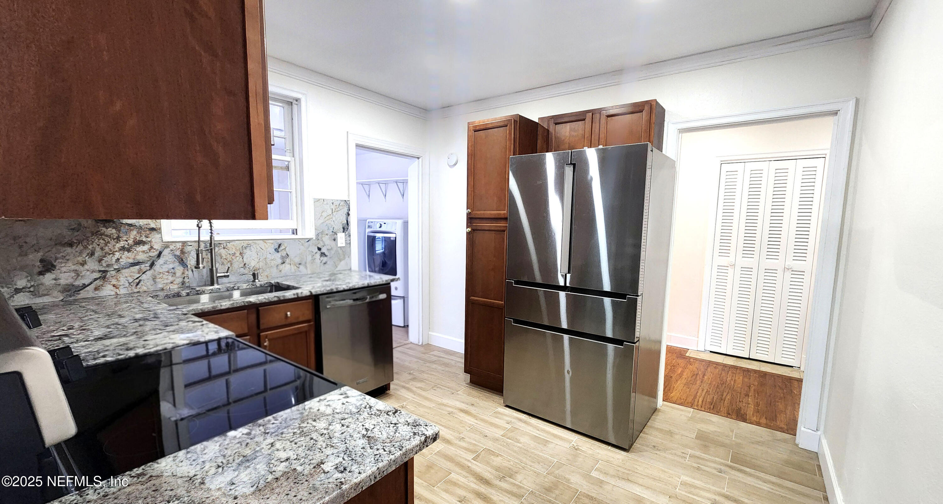 1418 Nicholson Road Jacksonville, FL 32207 - Photo 24 of 35 a kitchen with stainless steel appliances granite countertop a refrigerator and a stove