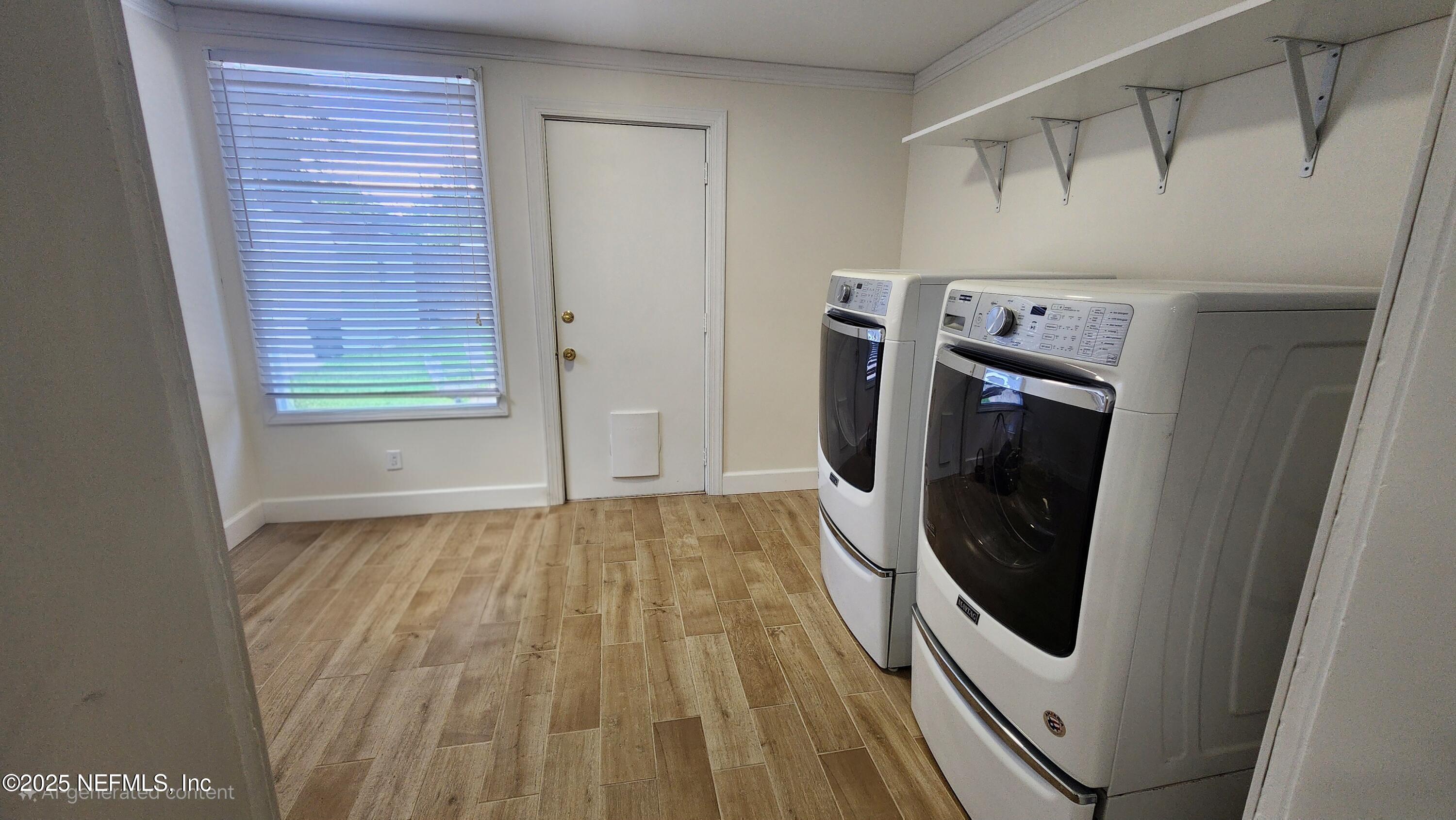 1418 Nicholson Road Jacksonville, FL 32207 - Photo 26 of 35 a view of storage and utility room with washer and dryer