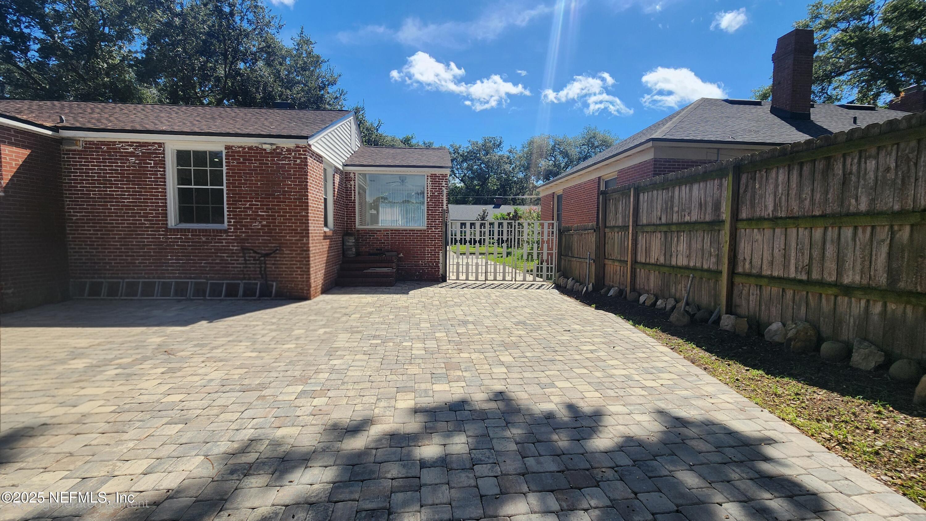 1418 Nicholson Road Jacksonville, FL 32207 - Photo 34 of 35 a front view of a house with a yard