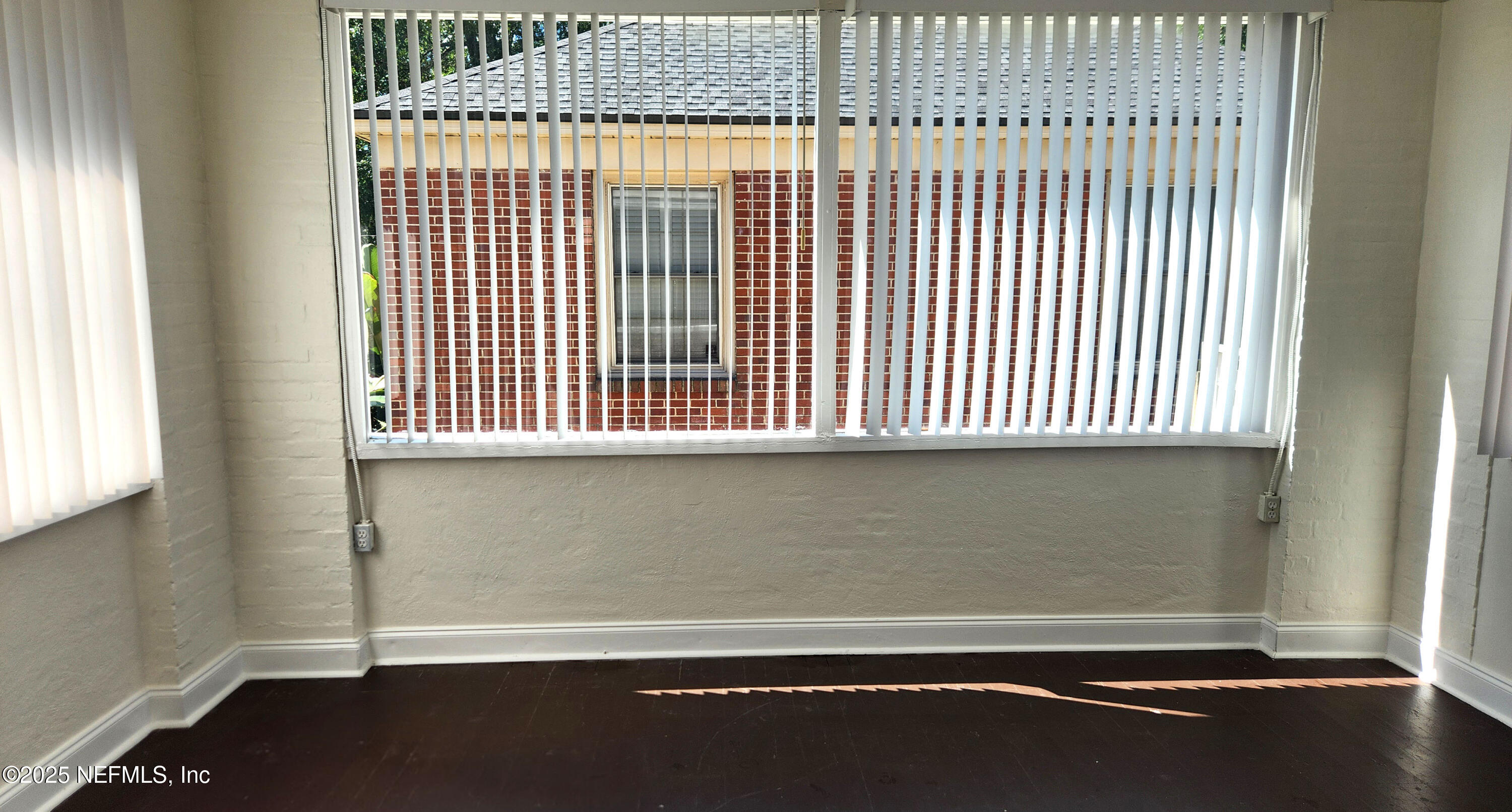 1418 Nicholson Road Jacksonville, FL 32207 - Photo 6 of 35 a view of a livingroom with an empty space and a window