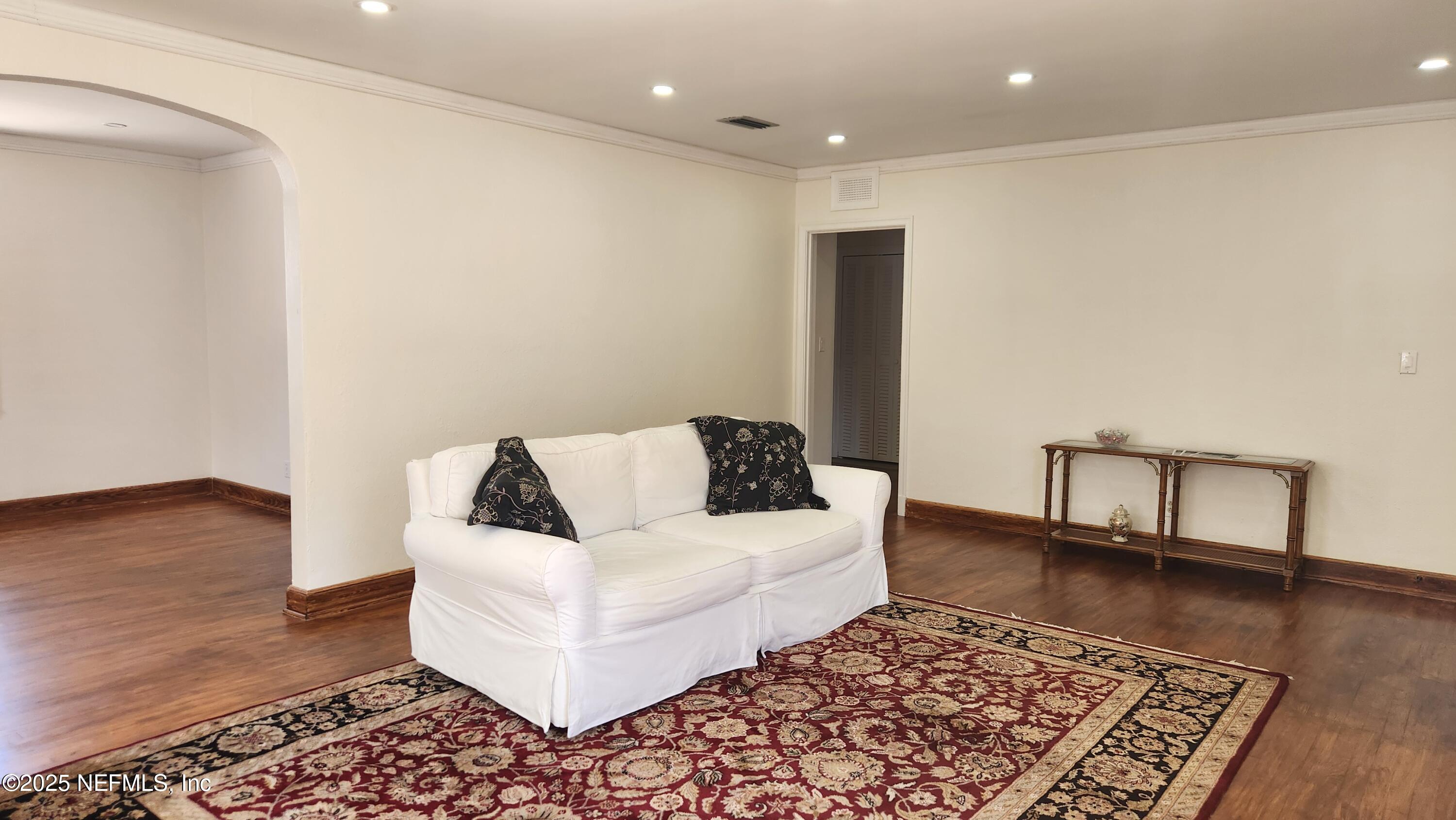 1418 Nicholson Road Jacksonville, FL 32207 - Photo 7 of 35 a living room with furniture and a rug