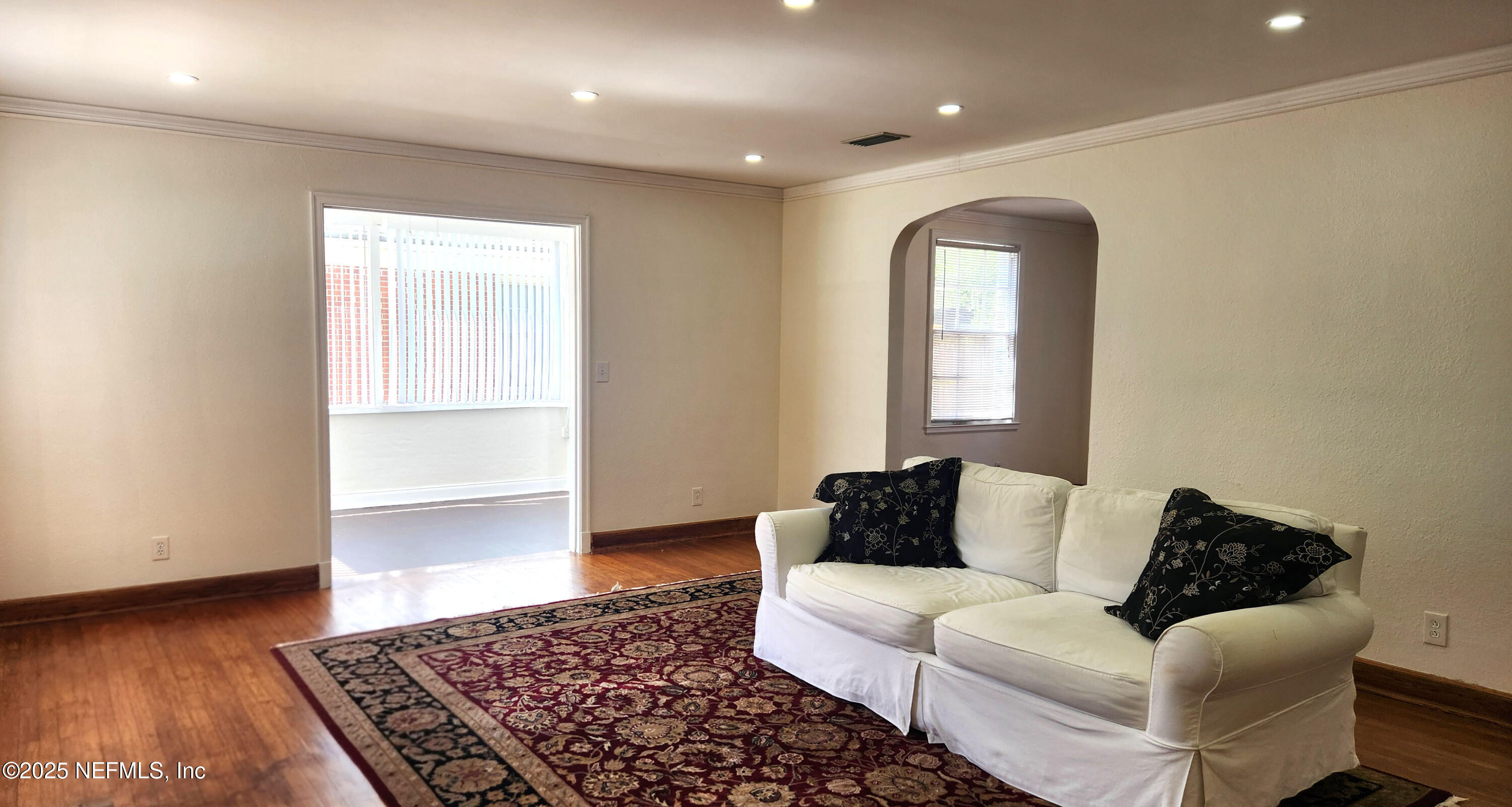 1418 Nicholson Road Jacksonville, FL 32207 - Photo 8 of 35 a living room with furniture and a rug