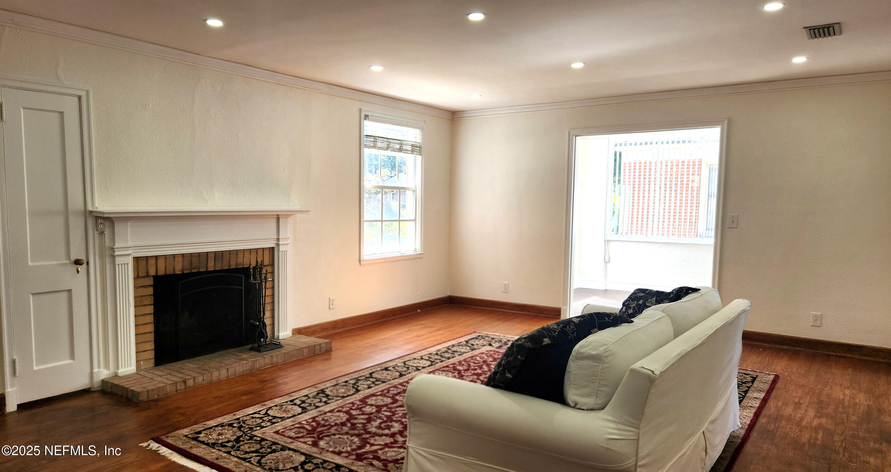 1418 Nicholson Road Jacksonville, FL 32207 - Photo 9 of 35 a living room with furniture and a fireplace