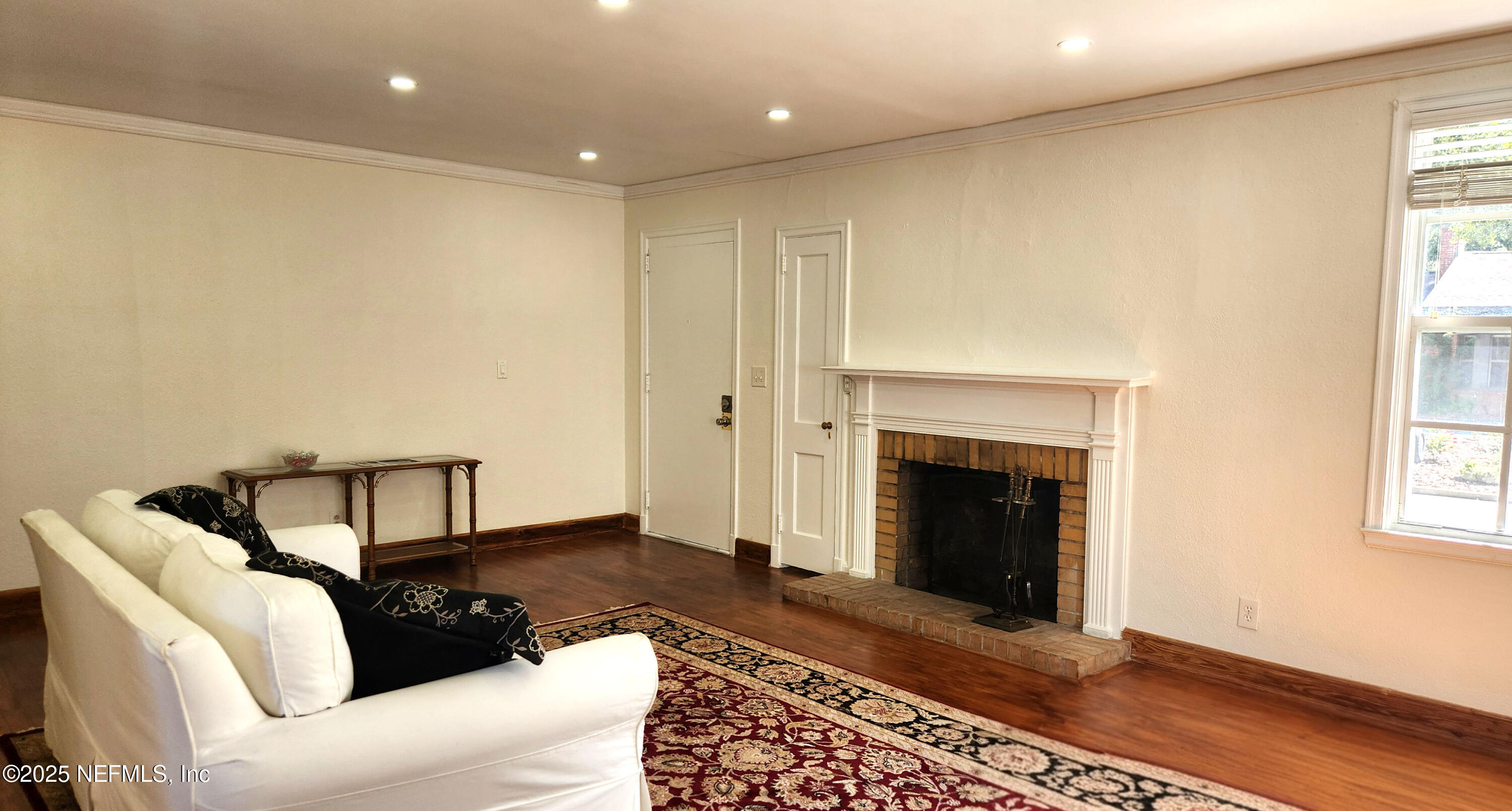 1418 Nicholson Road Jacksonville, FL 32207 - Photo 10 of 35 a living room with furniture and a fireplace