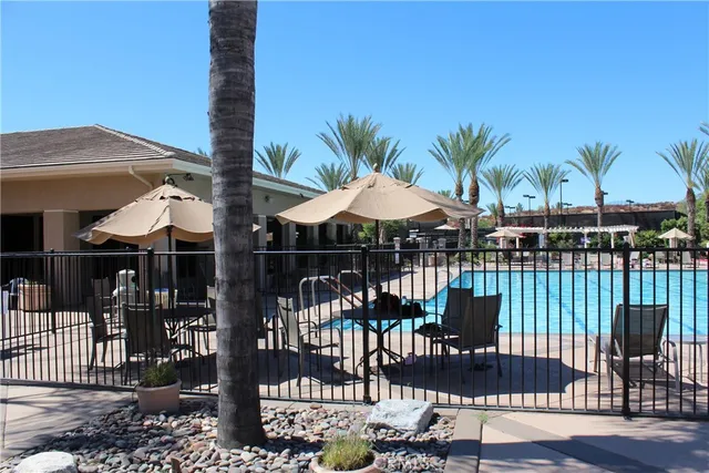 a view of a patio with a table and chairs