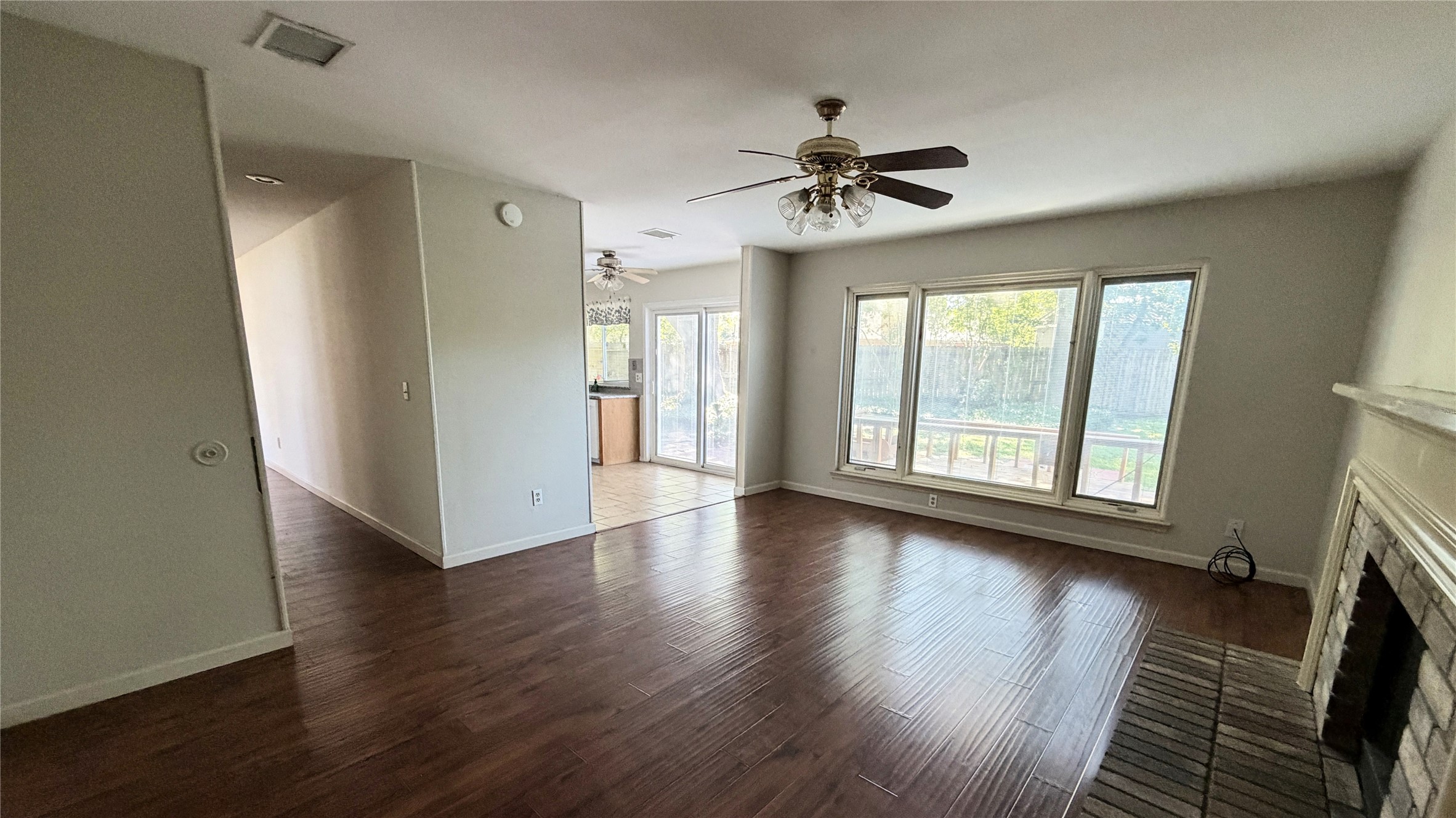 7771 Springville Drive Houston, TX 77095 - Photo 8 of 13 Bright family room featuring large windows and abundant natural light, perfect for a cozy layout.