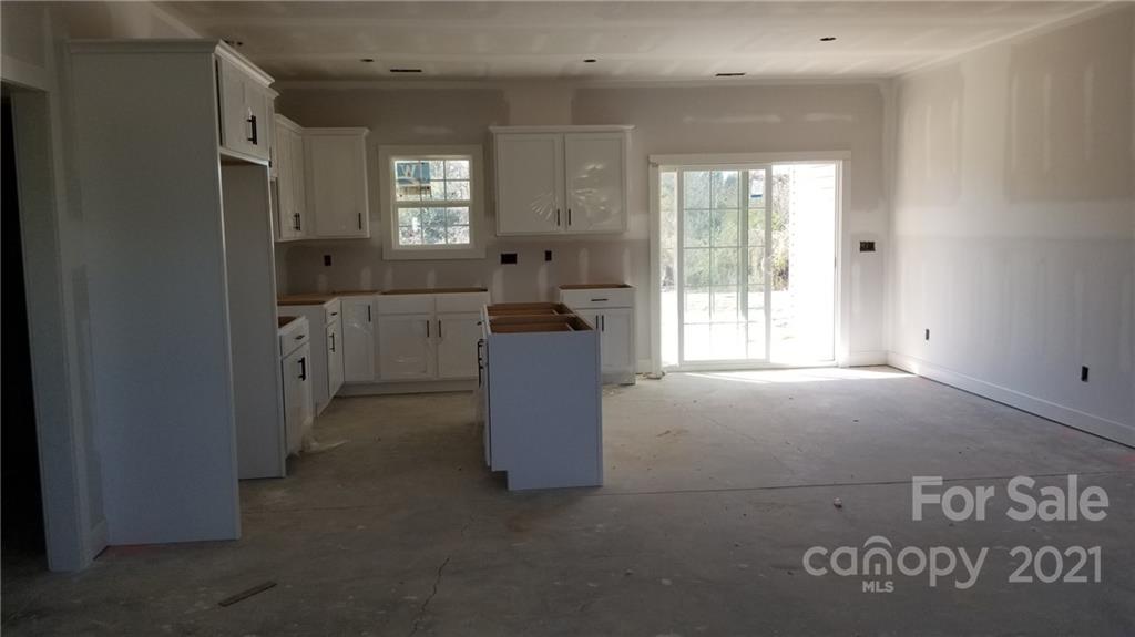 2135 State Rd S-46-1474, Unit 5 Clover, SC 29710 - Photo 3 of 18 a view of a hallway with entryway and windows