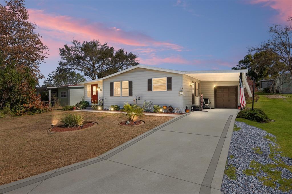 a backyard of a house with yard fire pit and outdoor seating