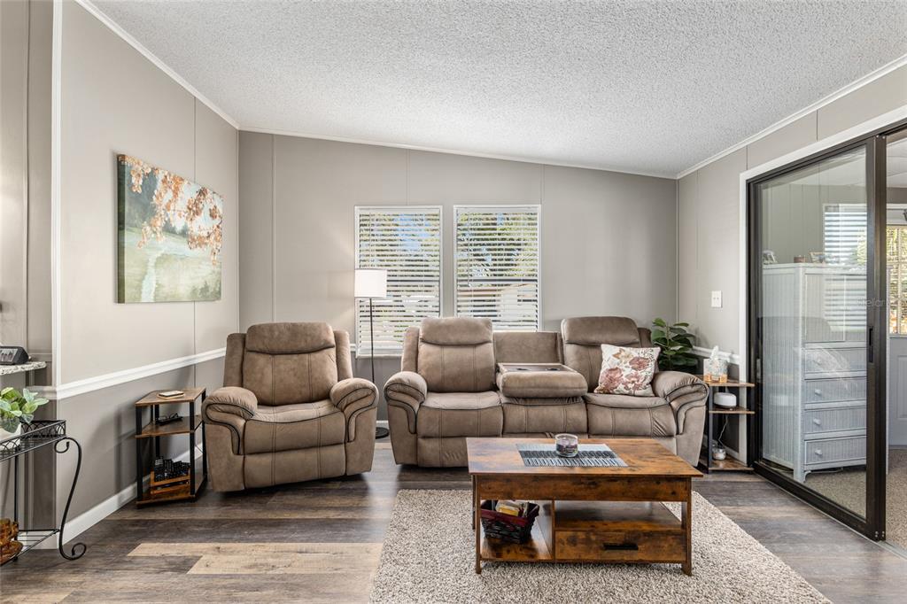 1727 Hilton Head Boulevard Lady Lake, FL 32159 - Photo 12 of 39 a living room with furniture and a window