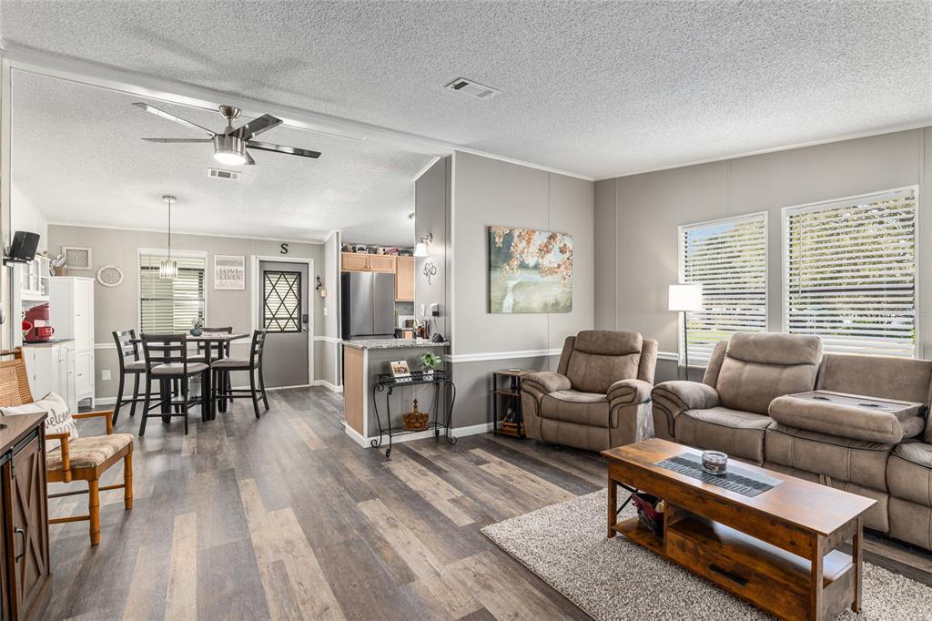 1727 Hilton Head Boulevard Lady Lake, FL 32159 - Photo 13 of 39 a living room with furniture and a large window