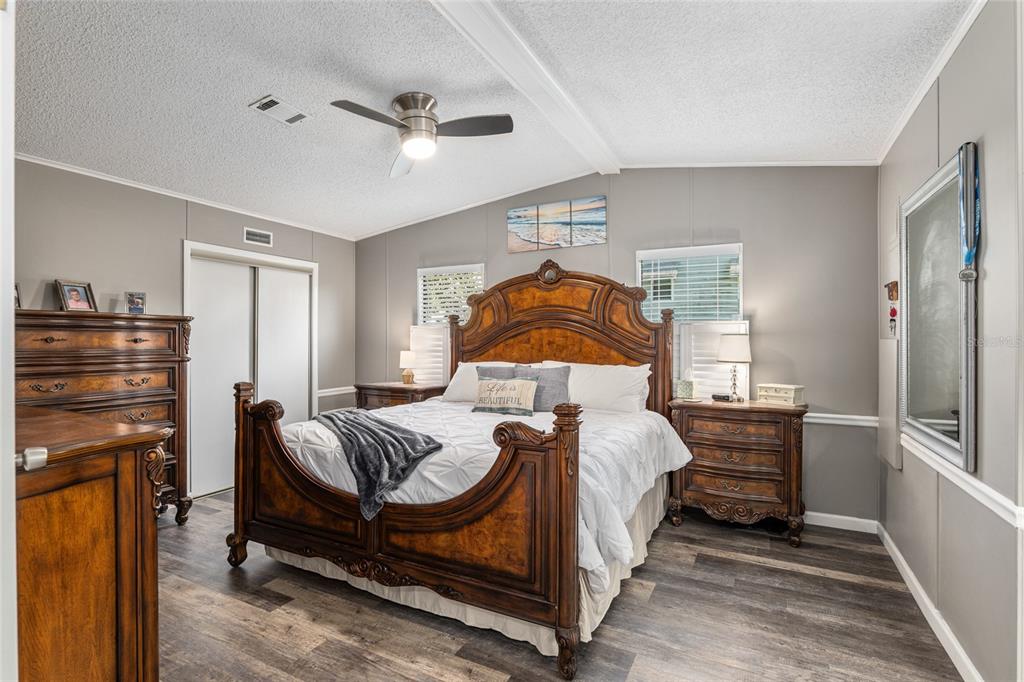 1727 Hilton Head Boulevard Lady Lake, FL 32159 - Photo 17 of 39 a bedroom with a bed and wooden floor