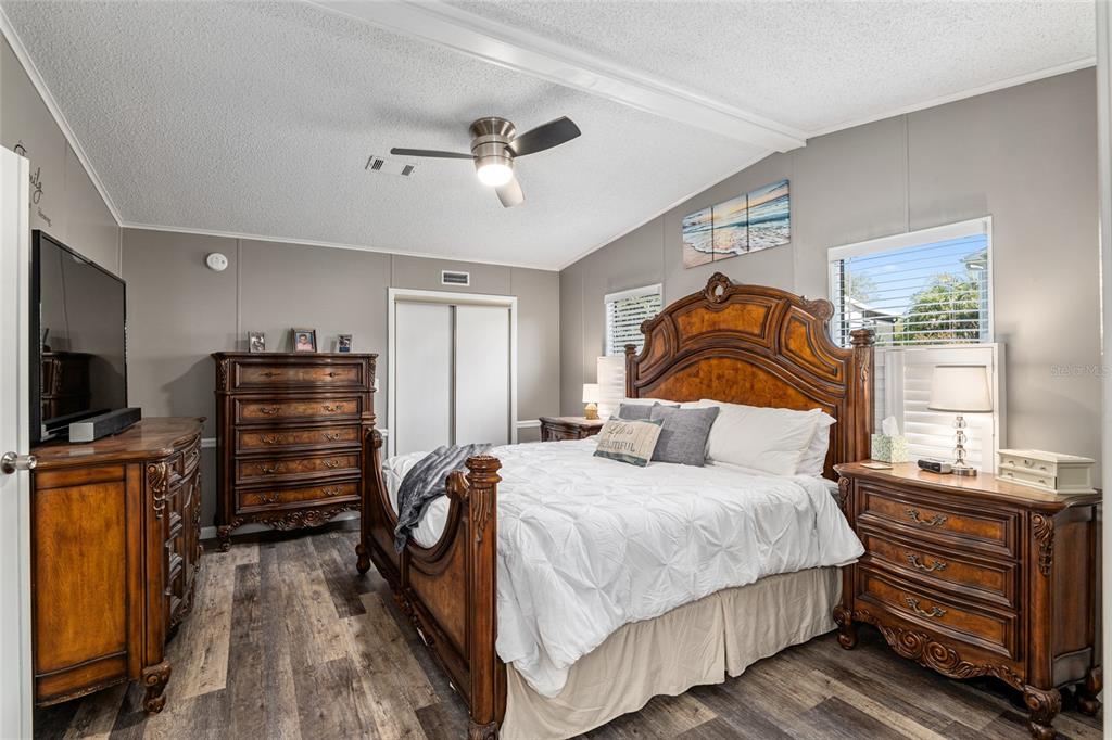 1727 Hilton Head Boulevard Lady Lake, FL 32159 - Photo 19 of 39 a bedroom with a bed and a flat screen tv