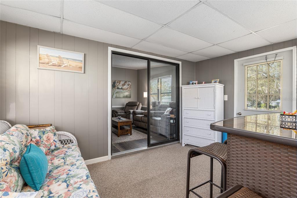 1727 Hilton Head Boulevard Lady Lake, FL 32159 - Photo 29 of 39 a bedroom with a bed and a mirror