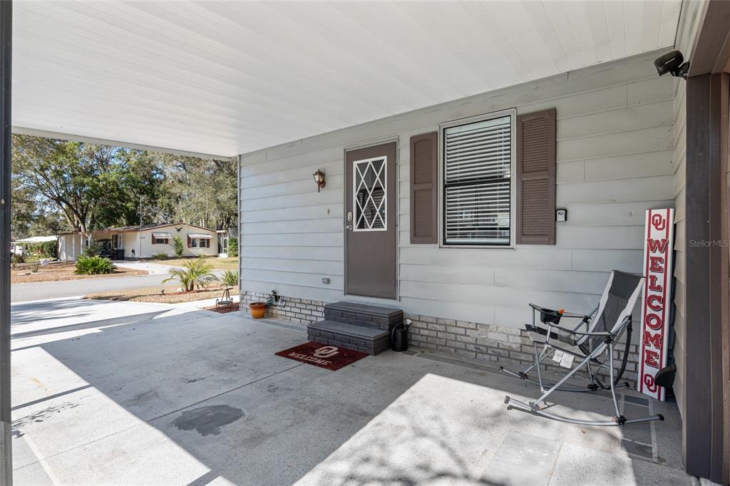 1727 Hilton Head Boulevard Lady Lake, FL 32159 - Photo 35 of 39 a view of a patio with a table and chairs