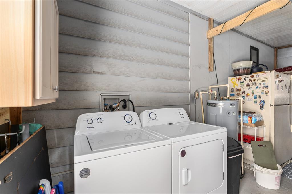 1727 Hilton Head Boulevard Lady Lake, FL 32159 - Photo 36 of 39 a utility room with dryer and washer