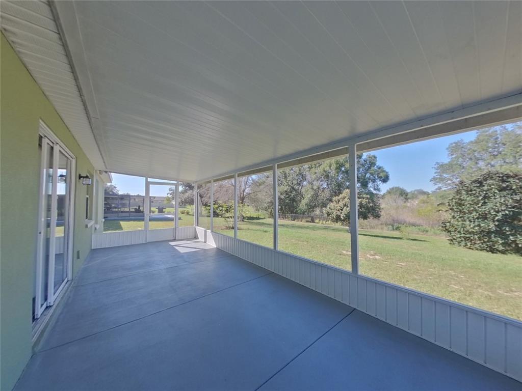 Undisclosed Address Davenport, FL 33837 - Photo 16 of 17 a view of a room with open to large windows