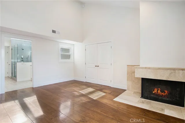 a view of an empty room with a fireplace