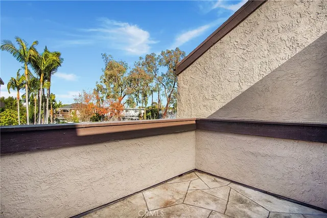 a view of balcony with two potted plants