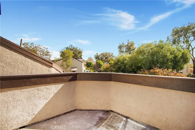 a view of balcony with a forest