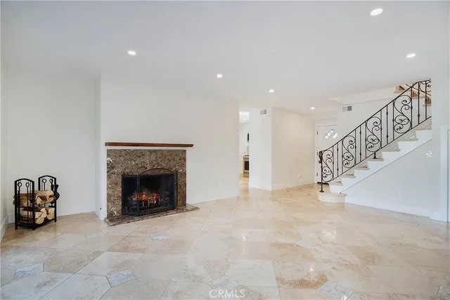 a view of an empty room with a fireplace