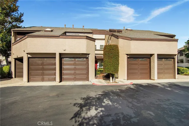 a front view of a house with a garage