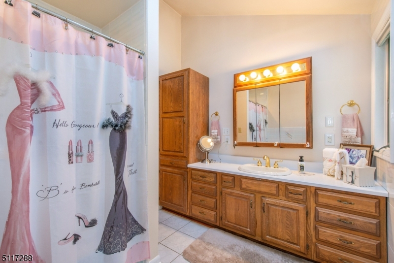 5 Spring Lane Warren, NJ 07059 - Photo 13 of 31 a bathroom with a double vanity sink mirror and shower