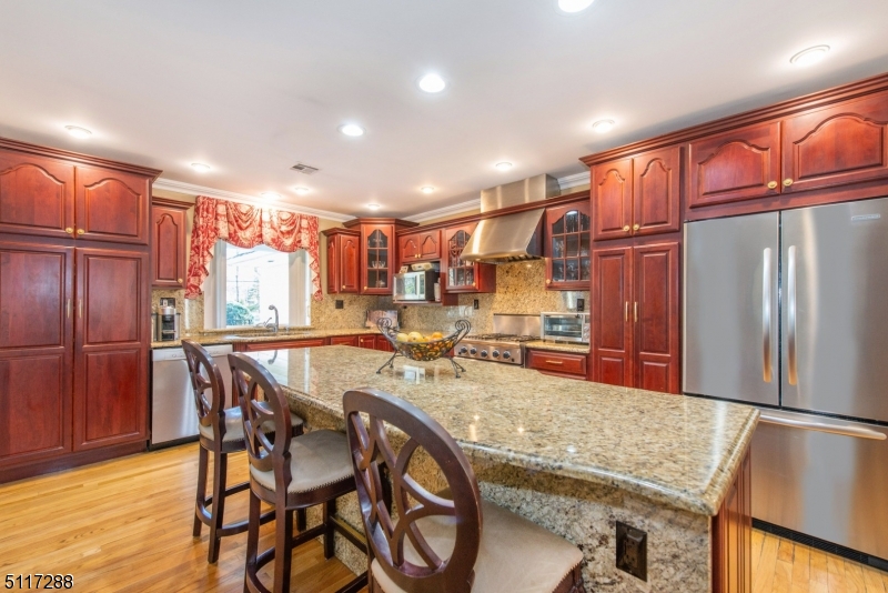 5 Spring Lane Warren, NJ 07059 - Photo 15 of 31 a kitchen with stainless steel appliances granite countertop a refrigerator and a stove top oven