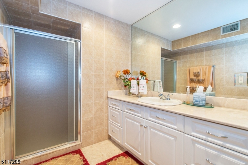 5 Spring Lane Warren, NJ 07059 - Photo 17 of 31 a bathroom with a granite countertop sink and a mirror