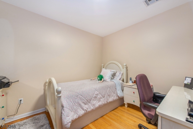 5 Spring Lane Warren, NJ 07059 - Photo 20 of 31 a bedroom with a bed and a chair