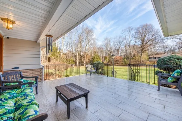 a view of a bench in the backyard