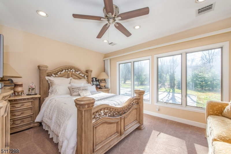 5 Spring Lane Warren, NJ 07059 - Photo 21 of 31 a bedroom with a bed and a large window