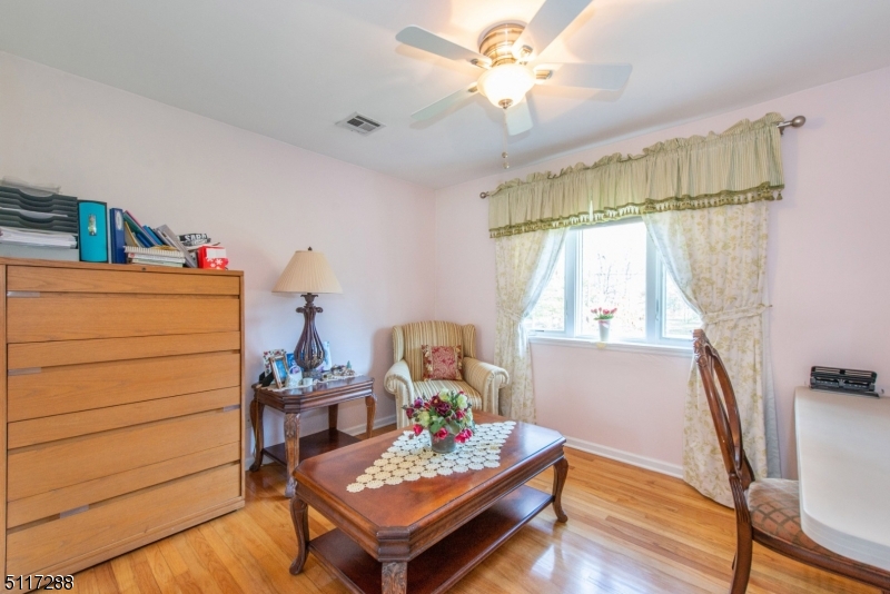 5 Spring Lane Warren, NJ 07059 - Photo 22 of 31 a living room with furniture and a window