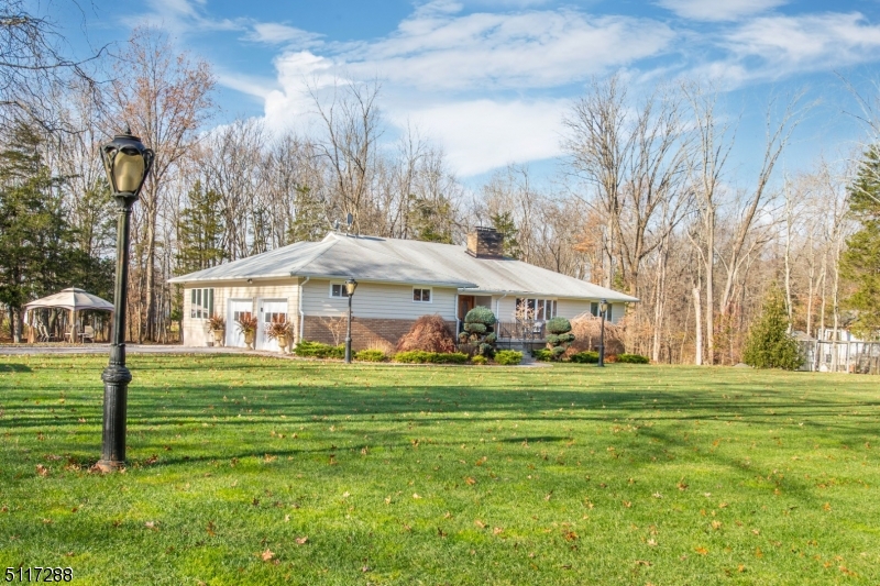 5 Spring Lane Warren, NJ 07059 - Photo 27 of 31 a view of a big house with a big yard and large trees