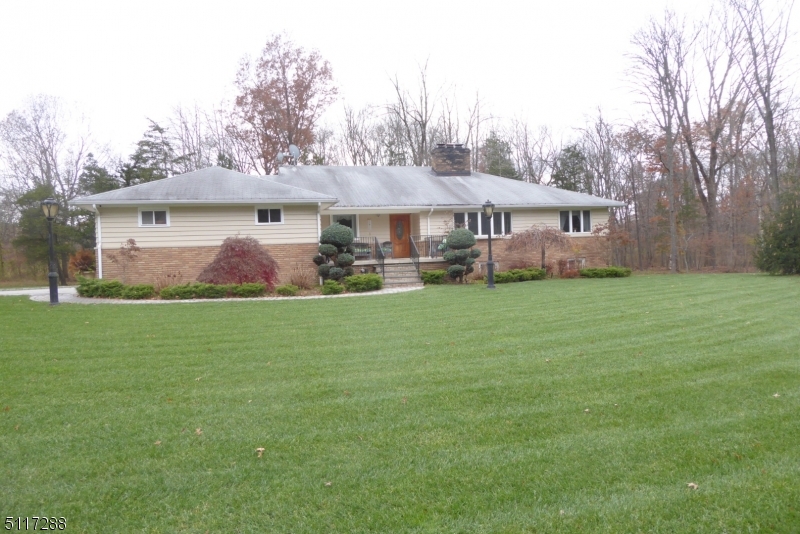 5 Spring Lane Warren, NJ 07059 - Photo 31 of 31 a front view of a house with a garden and trees