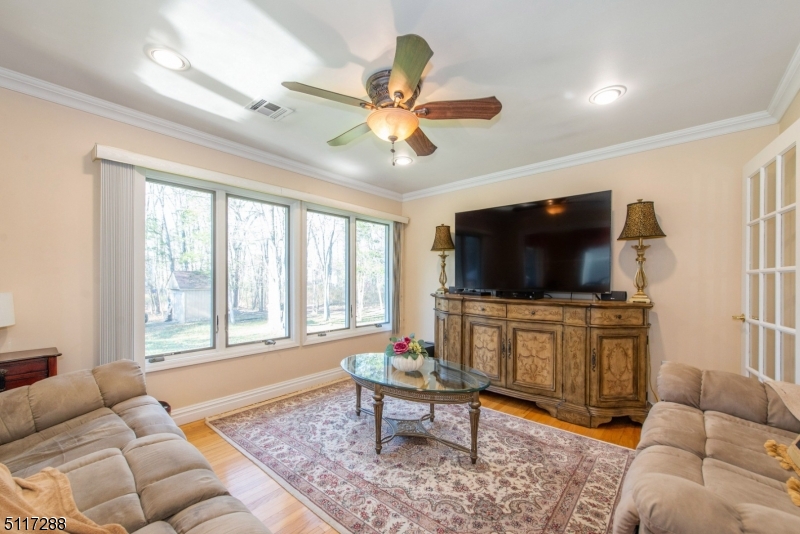 5 Spring Lane Warren, NJ 07059 - Photo 4 of 31 a living room with furniture and a flat screen tv