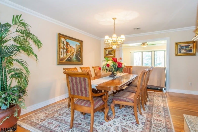 5 Spring Lane Warren, NJ 07059 - Photo 6 of 31 a view of a dining room with furniture and wooden floor