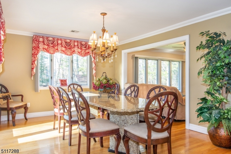 5 Spring Lane Warren, NJ 07059 - Photo 8 of 31 a view of a dining room with furniture window and wooden floor