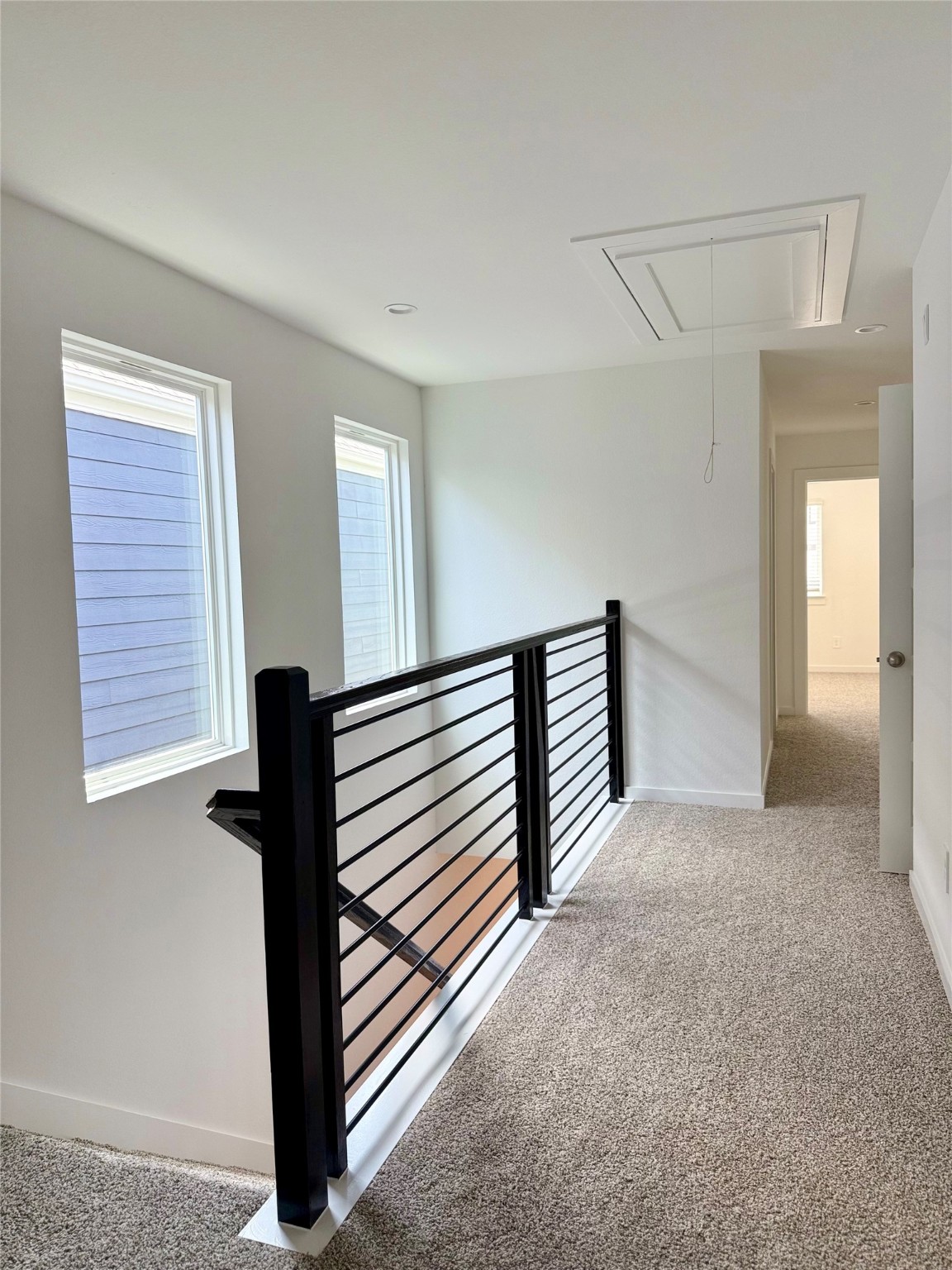 2911 Needham Gdn Lane Houston, TX 77051 - Photo 14 of 50 a view of a hallway with paintings on the wall