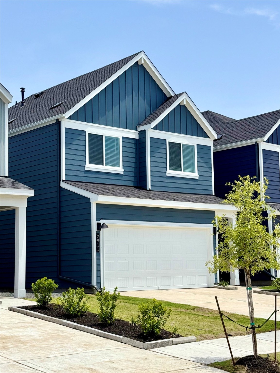 2911 Needham Gdn Lane Houston, TX 77051 - Photo 2 of 50 a front view of a house with plants