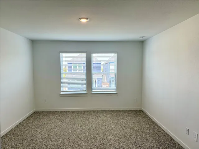 a view of an empty room and closet area