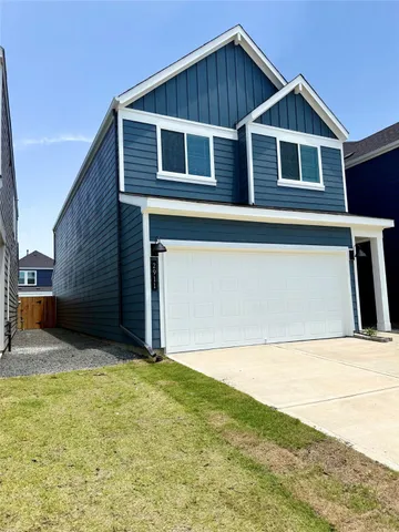 a front view of a house with yard
