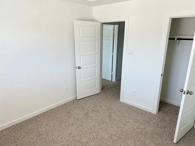 a view of a hallway with staircase