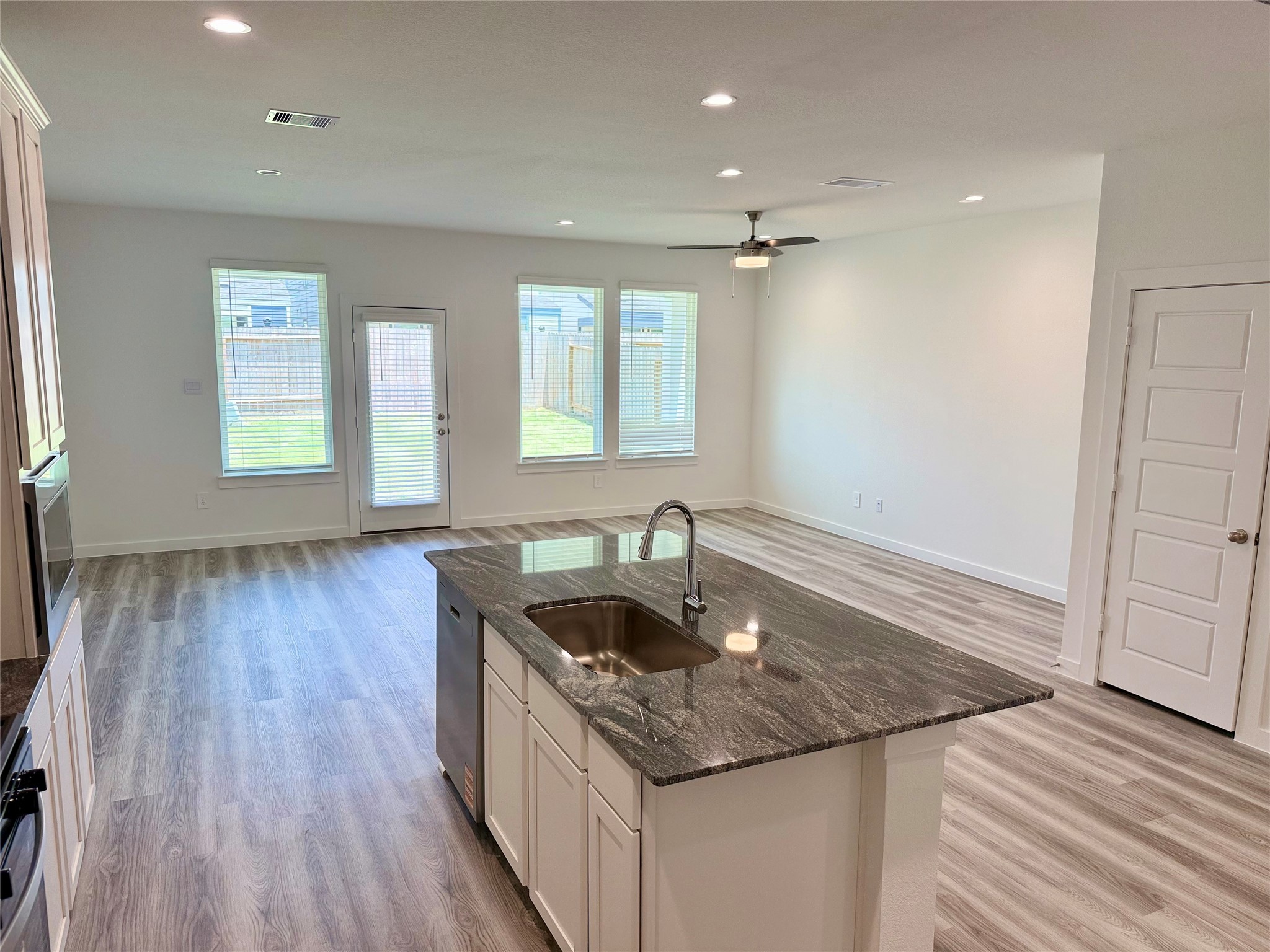2911 Needham Gdn Lane Houston, TX 77051 - Photo 9 of 50 a kitchen with granite countertop a sink and a stove top oven