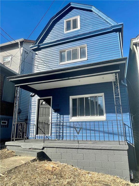 112 Patterson Street McKees Rocks, PA 15136 - Photo 1 of 17 a front view of a house with a garage
