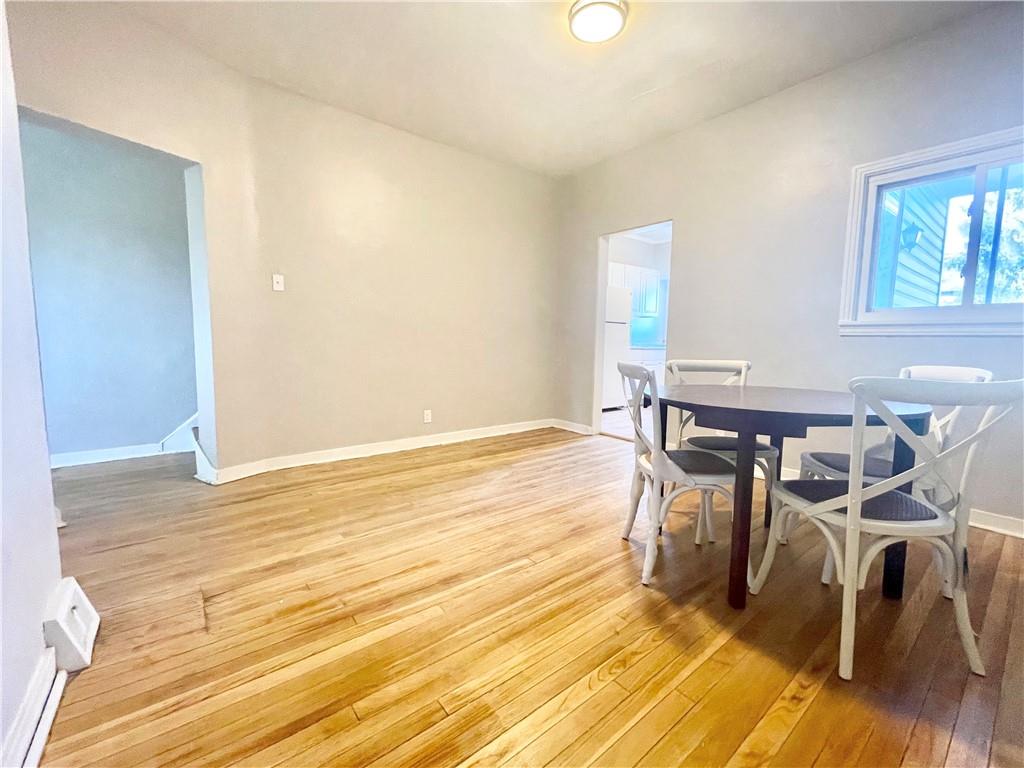 112 Patterson Street McKees Rocks, PA 15136 - Photo 6 of 17 a view of a dining room with furniture and wooden floor