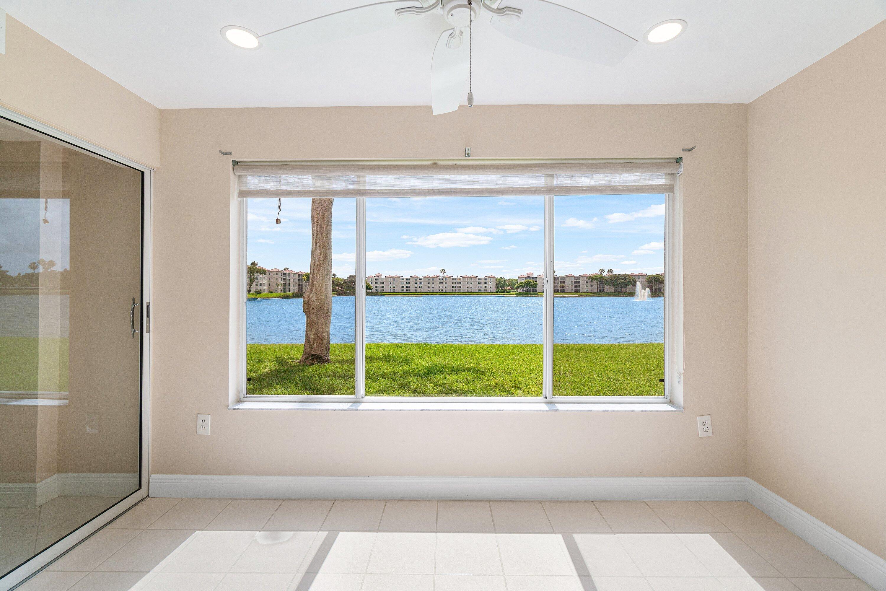 14096 Huntington Pointe Drive, Unit 106 Delray Beach, FL 33484 - Photo 31 of 47 a view of a room that has a bed and a window