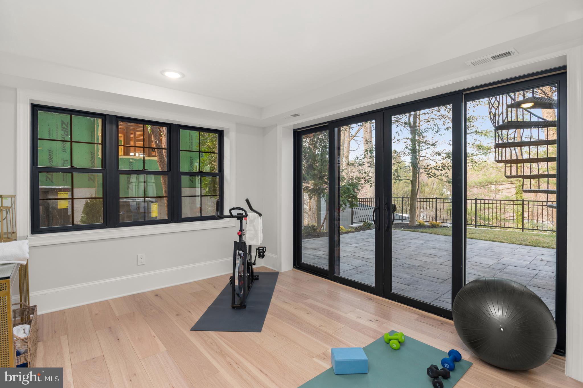 5045 Overlook Road Northwest Washington, DC 20016 - Photo 41 of 50 Home gym with sliding glass door to patio
