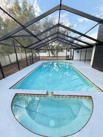 a big yard with wooden fence