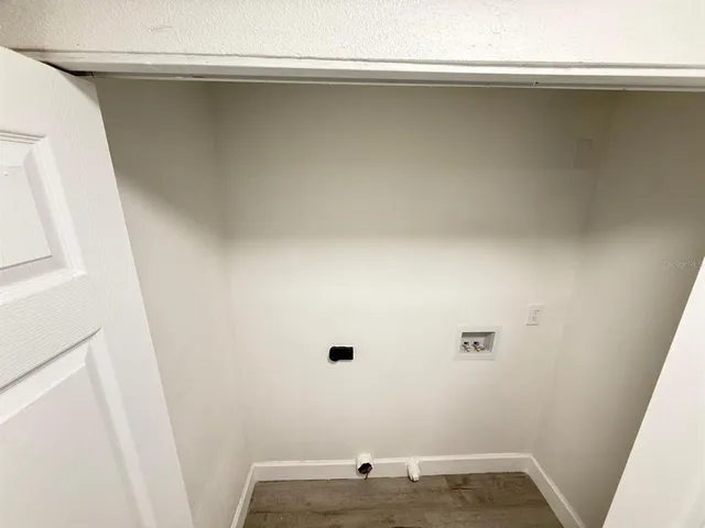 a kitchen with stainless steel appliances a refrigerator sink and microwave