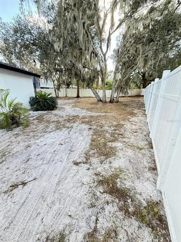 a view of outdoor space with deck and trees